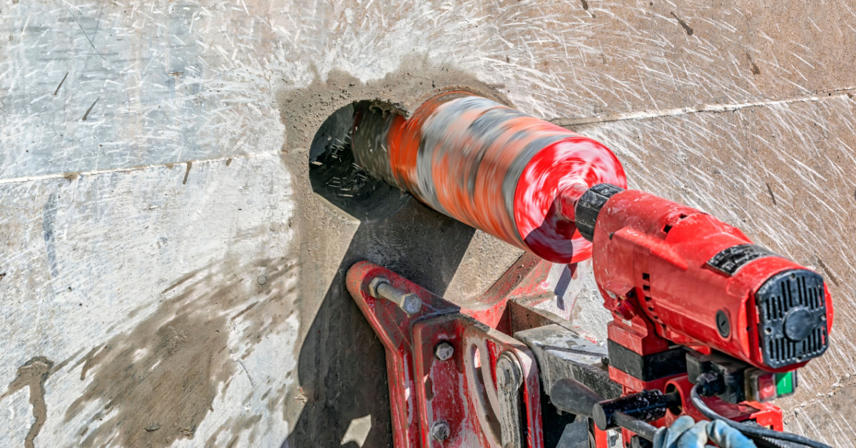 Drilling concrete wall with core drill machine